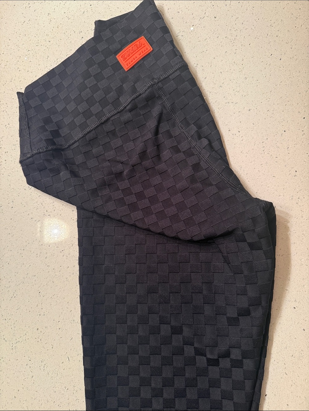 Zumba Fitness Black Checkerboard Leggings with Orange Logo Patch